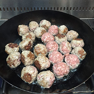 Fry the meatballs until browned. Fry the meatballs until browned.