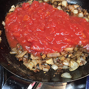 Add the tomato sauce and simmer until thickened. Add the tomato sauce and simmer until thickened.