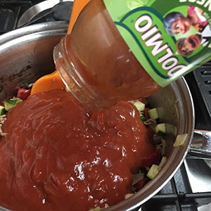 Add the Dolmio sauce. Add the Dolmio sauce.