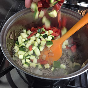 Add the pepper and courgette. Add the pepper and courgette.