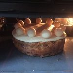 Place the cake under a hot grill. Place the cake under a hot grill.