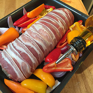 Drizzle the peppers and onion wedges with oil. Drizzle the peppers and onion wedges with oil.