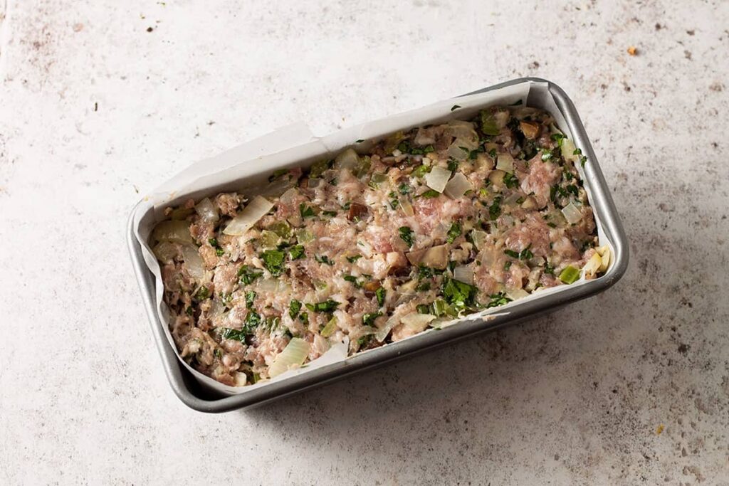 uncooked stuffing in loaf tin.